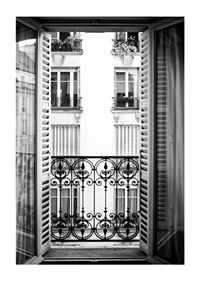 Black and white photo of open window with wrought iron balcony-1