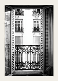 Black and white photo of open window with wrought iron balcony-3