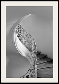 Black and white photograph of spiral staircase with wrought iron railing-2