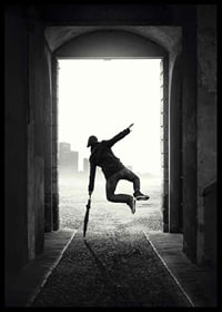 Black and white photograph of jumping man with umbrella in tunnel-6
