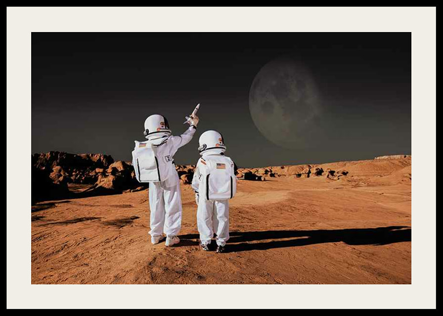 Two children in astronaut suits on red desert against dark sky-12