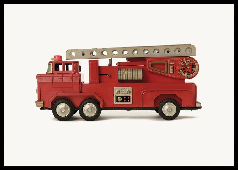Retro toy fire truck in red against light background-12