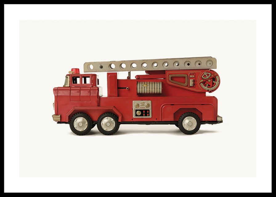 Retro toy fire truck in red against light background-12