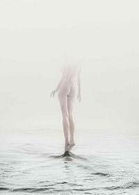 Photo art with naked woman partially hidden by fog over water-7