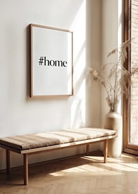 Black text with the word #home in stylish serif against a white background-2
