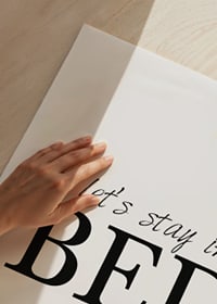 Black text with the words 'let’s stay in BED' on a white background-3