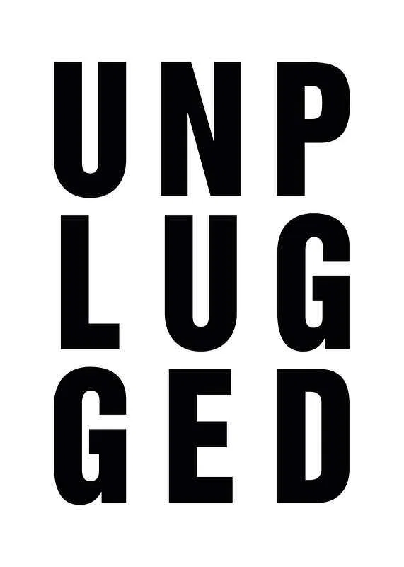 Black text UNPLUGGED in uppercase with capital letters-12