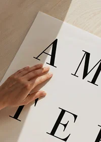 Black text Amsterdam in scattered letters on white background-3