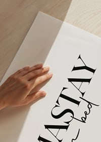 Black text with the words 'Namastay in bed' on a white background-3