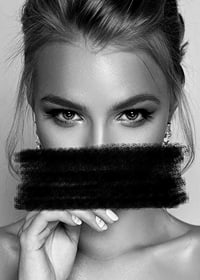 Black and white portrait of woman with black paint over mouth-7