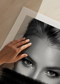Black and white portrait of woman with black paint over mouth-9