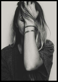 Black and white portrait of woman with hand over face-6