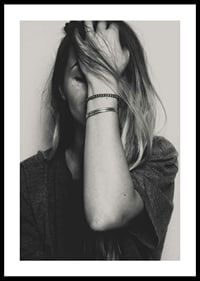 Black and white portrait of woman with hand over face-0