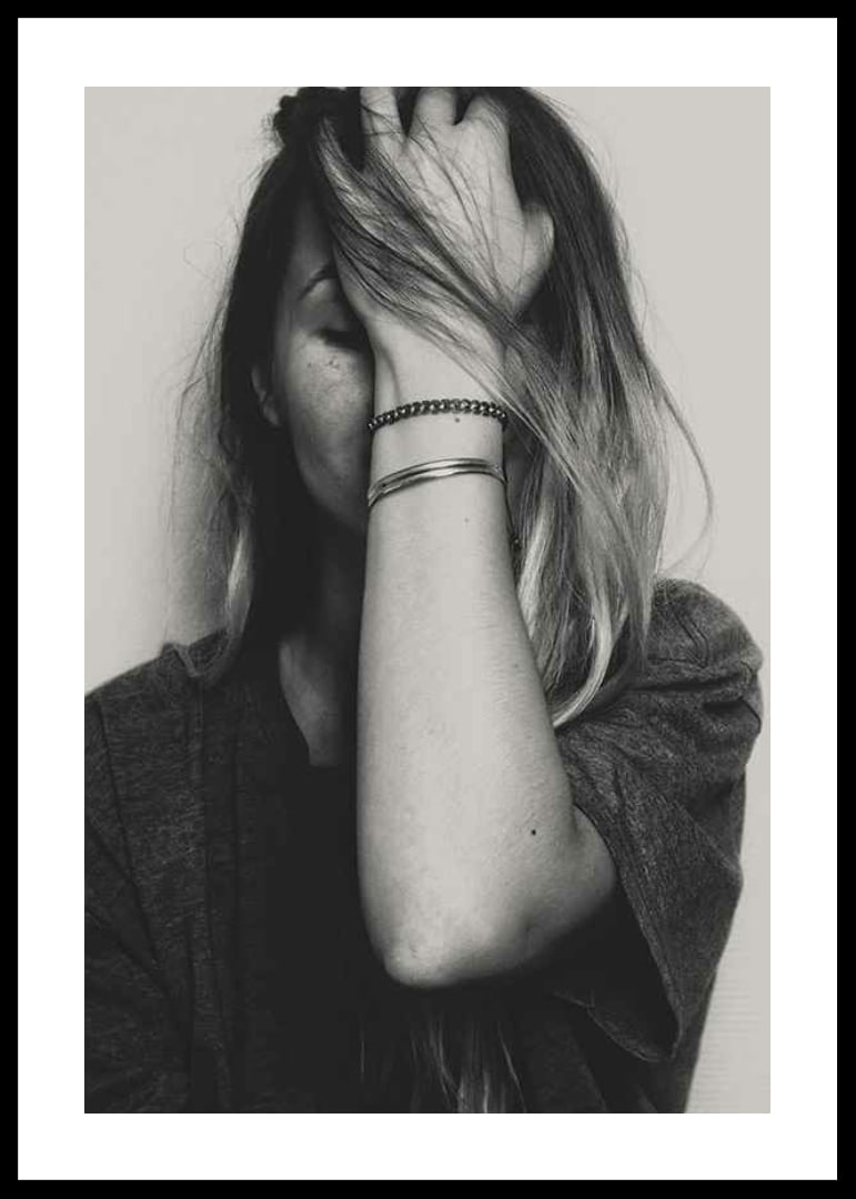 Black and white portrait of woman with hand over face-12