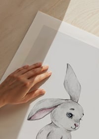 Illustrated gray rabbit with pink butterfly on light background-9