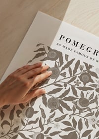 Graphic pattern with stylized pomegranates, green leaves and winding branches against a dark background-3