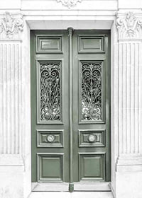 Photograph of green double door with decorative wrought iron-7