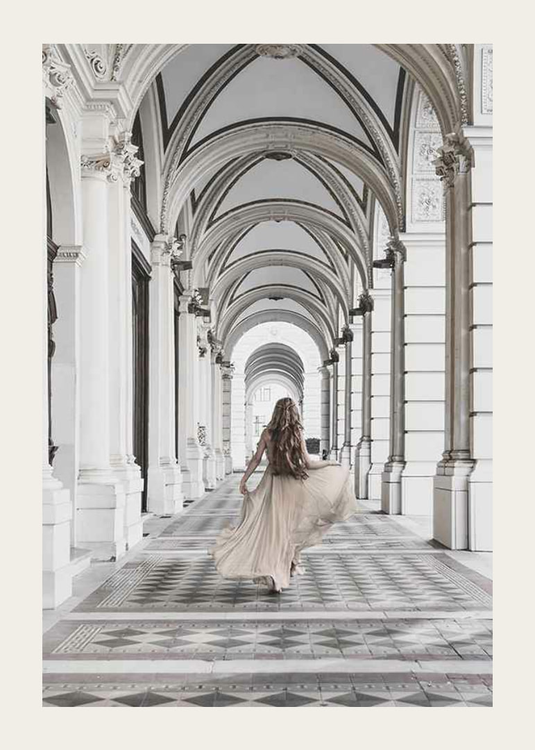 Photograph of woman in beige dress under arches-12