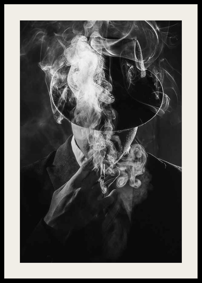 Black and white portrait of man in hat surrounded by cigarette smoke-12