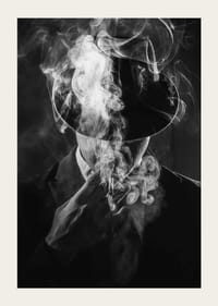 Black and white portrait of man in hat surrounded by cigarette smoke-5
