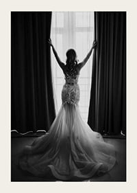Black and white photo of woman in lace dress by open window-3