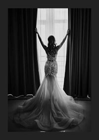 Black and white photo of woman in lace dress by open window-5