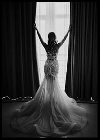 Black and white photo of woman in lace dress by open window-6