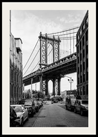 Black and white photograph of Manhattan Bridge between buildings-2