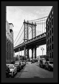 Black and white photograph of Manhattan Bridge between buildings-4