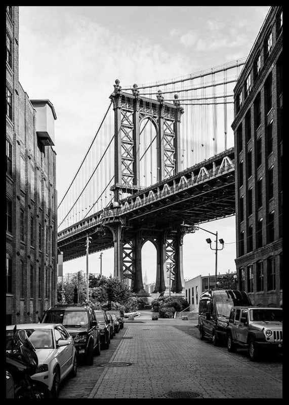 Black and white photograph of Manhattan Bridge between buildings-12
