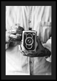 Black and white photo of tattooed hands holding a retro camera-4