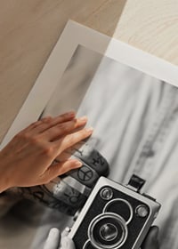 Black and white photo of tattooed hands holding a retro camera-9