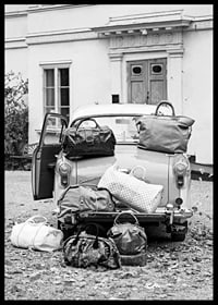 Black and white photo art with old car and suitcases outside house-6