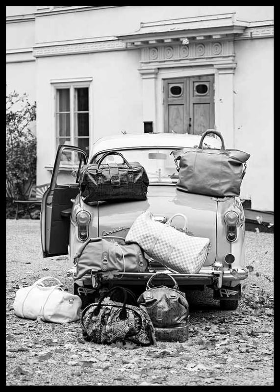 Black and white photo art with old car and suitcases outside house-12
