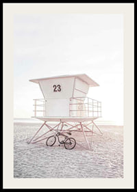 Photograph of white lifeguard tower on sandy beach in soft light-2