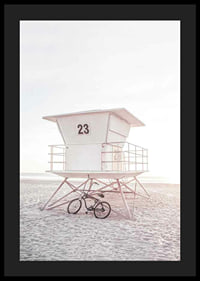 Photograph of white lifeguard tower on sandy beach in soft light-4