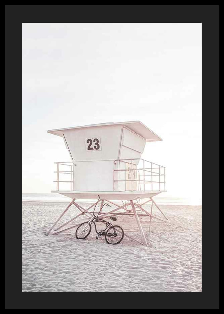 Photograph of white lifeguard tower on sandy beach in soft light-12