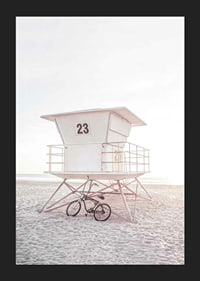 Photograph of white lifeguard tower on sandy beach in soft light-5