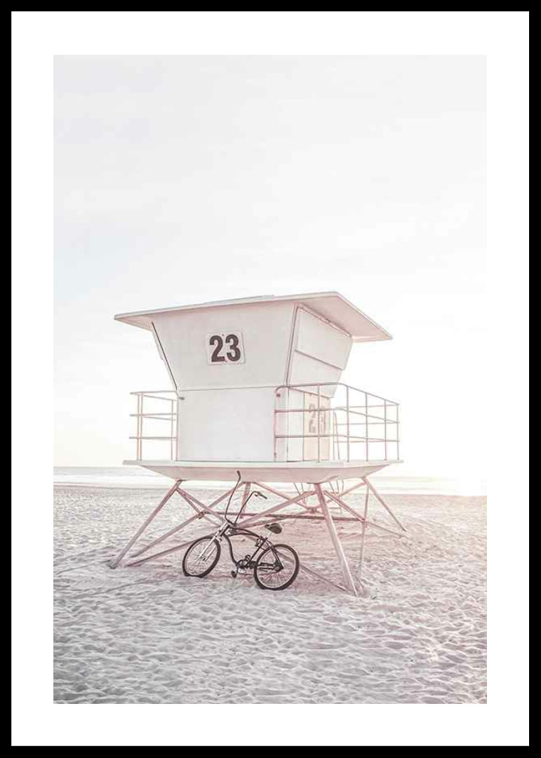 Photograph of white lifeguard tower on sandy beach in soft light-12