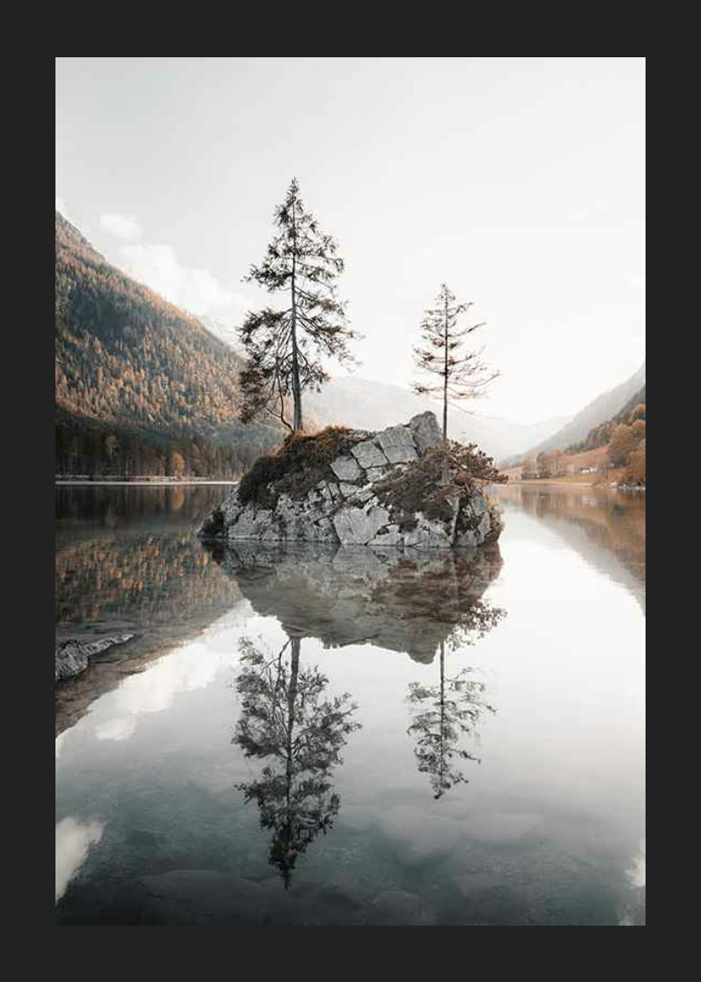 Photograph of small island with trees in mirror-like lake, autumn colors-12
