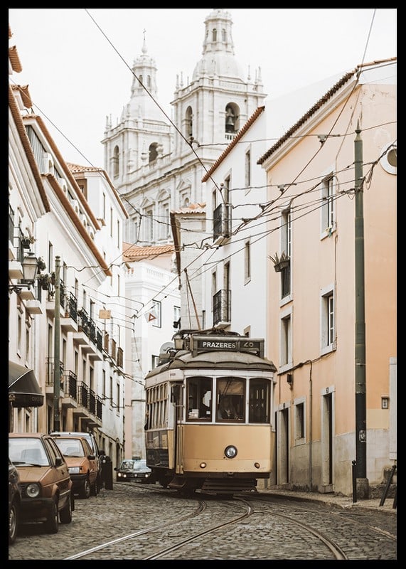 Photograph of yellow tram on narrow cobblestone street in Lisbon-12