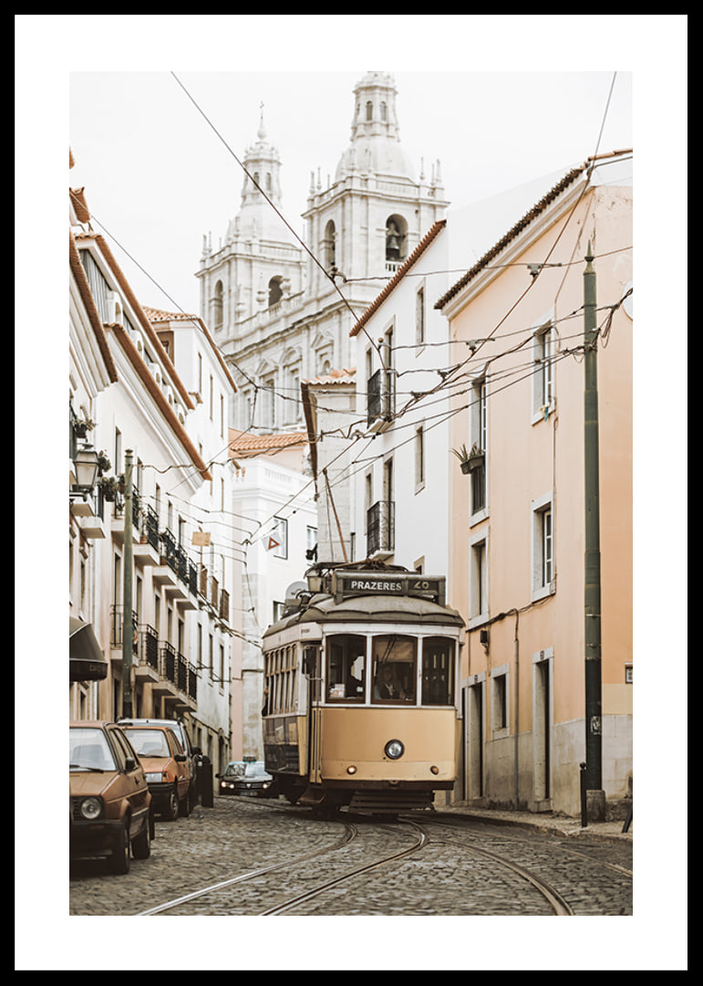 Photograph of yellow tram on narrow cobblestone street in Lisbon-12
