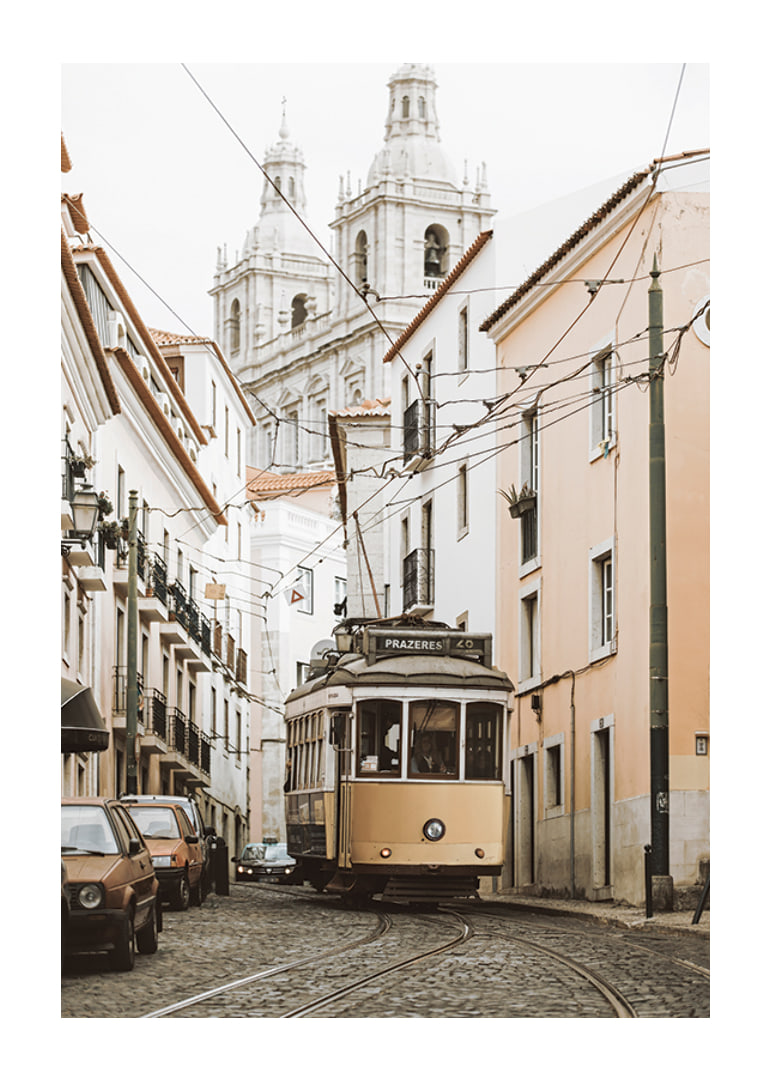 Photograph of yellow tram on narrow cobblestone street in Lisbon-12