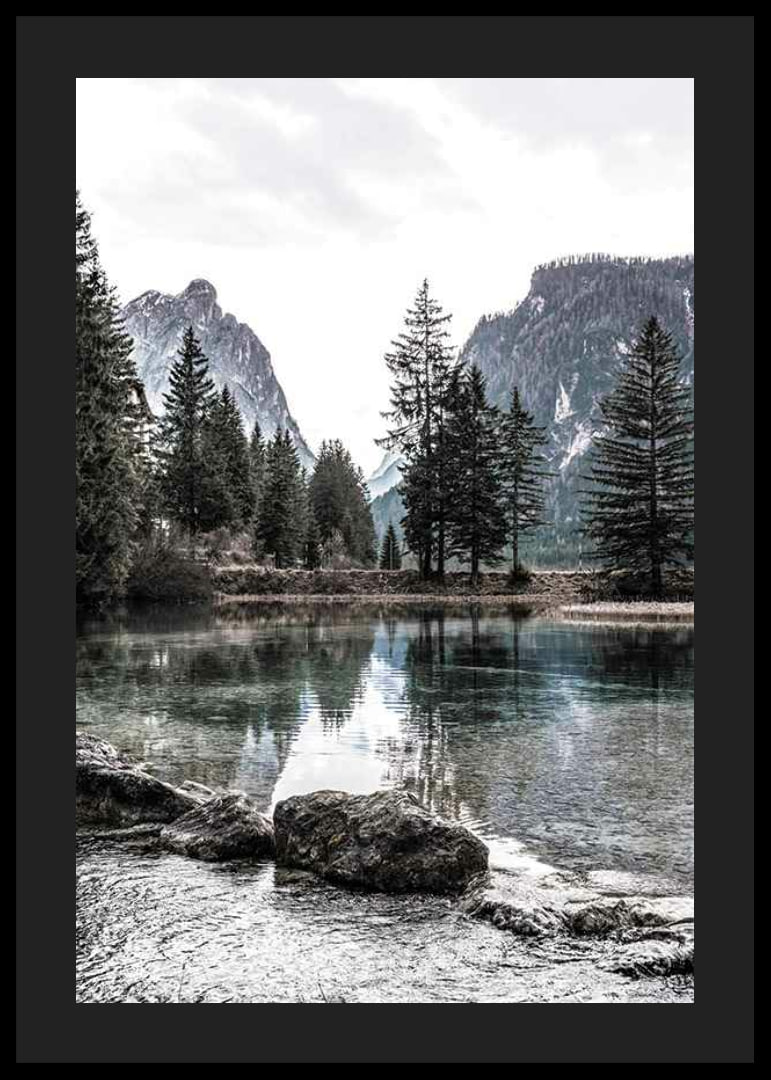 Photograph of alpine landscape with fir trees and clear lake-12