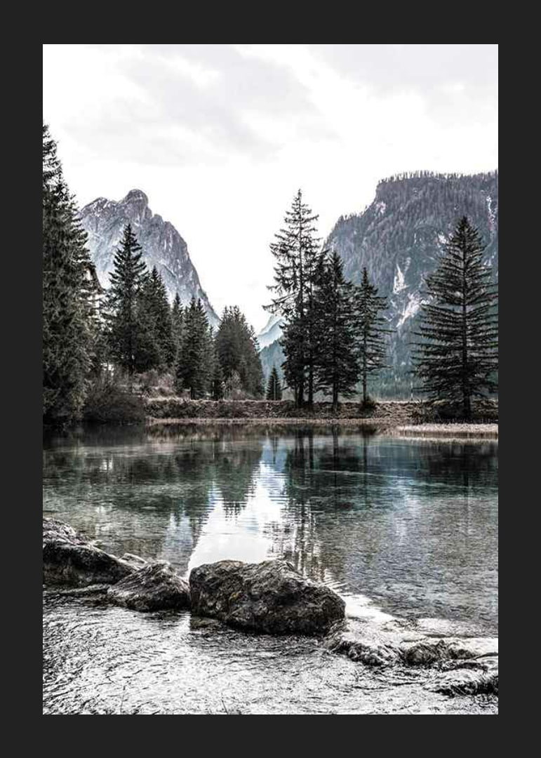 Photograph of alpine landscape with fir trees and clear lake-12