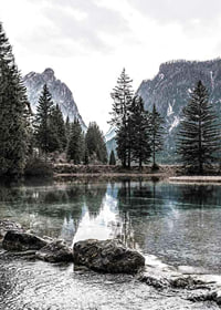 Photograph of alpine landscape with fir trees and clear lake-7