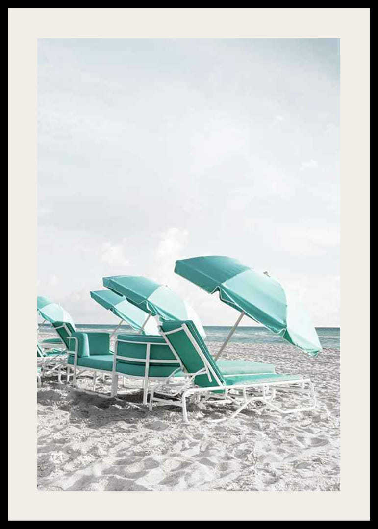 Photograph of turquoise umbrellas and sun loungers on beach-12