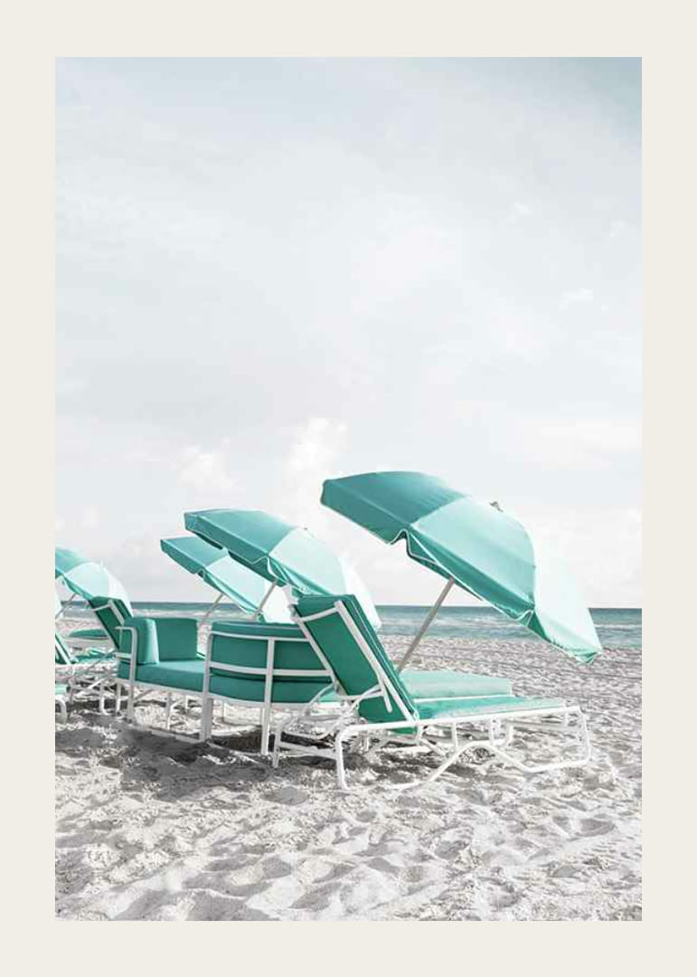 Photograph of turquoise umbrellas and sun loungers on beach-12