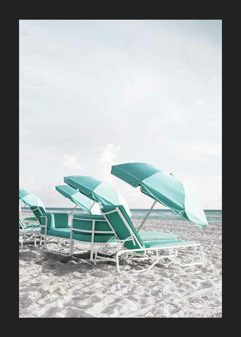Photograph of turquoise umbrellas and sun loungers on beach-12