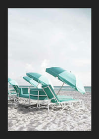 Photograph of turquoise umbrellas and sun loungers on beach-5
